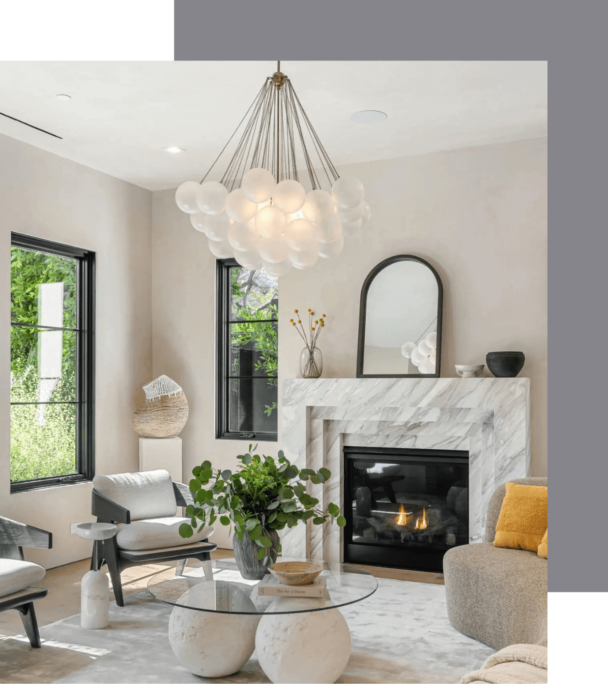 Elegant living room with modern furniture and a stylish chandelier.